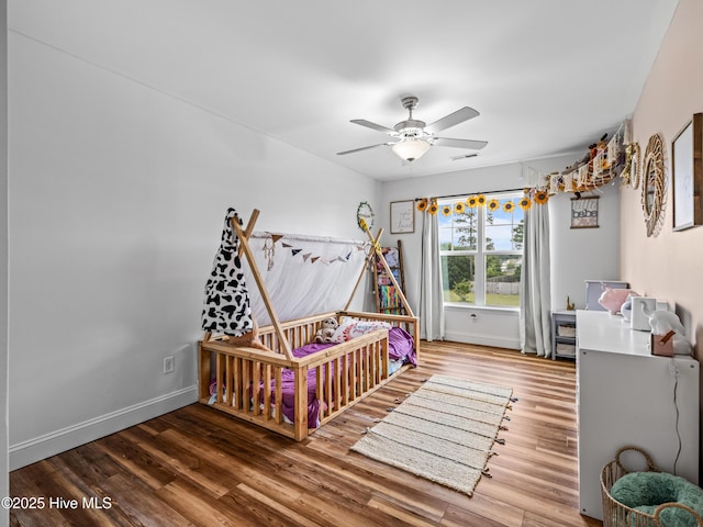 118 Prospect Dr, Richlands, NC 28574 - bedroom with wood finished floors, baseboards, and a ceiling fan
