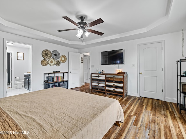 118 Prospect Dr, Richlands, NC 28574 - bedroom with a raised ceiling, hardwood / wood-style floors, baseboards, ensuite bath, and a ceiling fan