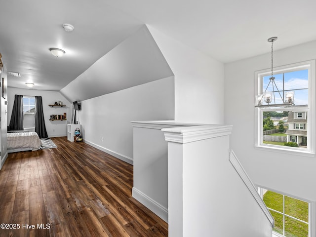 118 Prospect Dr, Richlands, NC 28574 - hallway with a chandelier, dark wood-style flooring, baseboards, and lofted ceiling