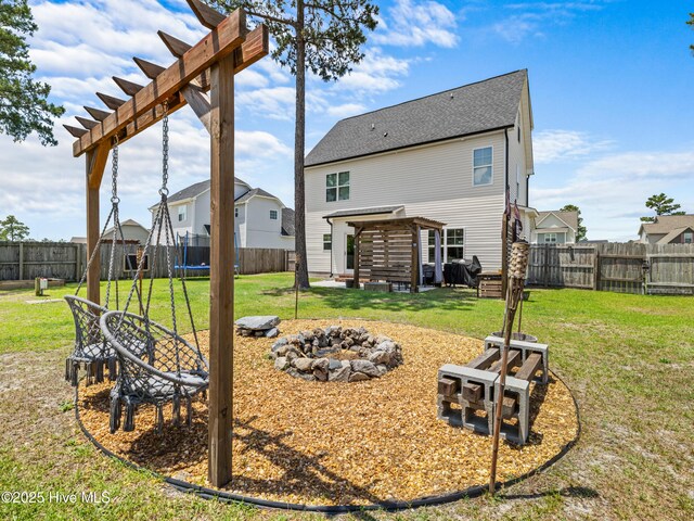 118 Prospect Dr, Richlands, NC 28574 - back of property with a fire pit, a trampoline, and a residential view
