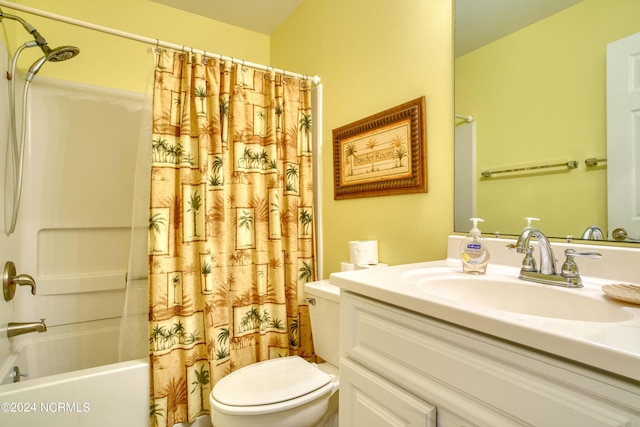bathroom featuring toilet, shower / bath combo, and vanity