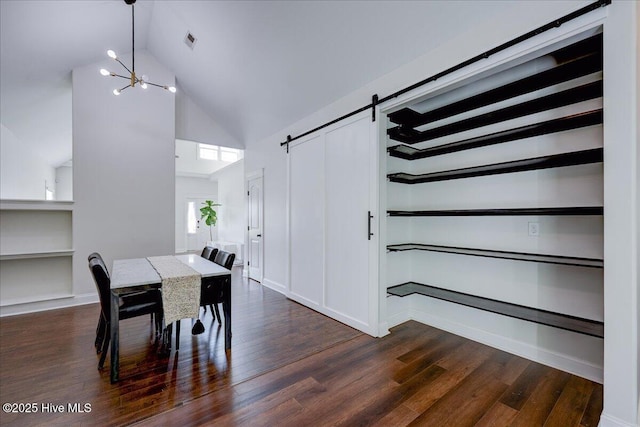 222 Station House Rd, New Bern, NC 28562 - dining space featuring a barn door, a chandelier, high vaulted ceiling, dark wood-type flooring, and built in shelves