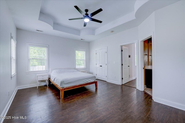 222 Station House Rd, New Bern, NC 28562 - bedroom featuring wood finished floors, a raised ceiling, baseboards, and ensuite bathroom