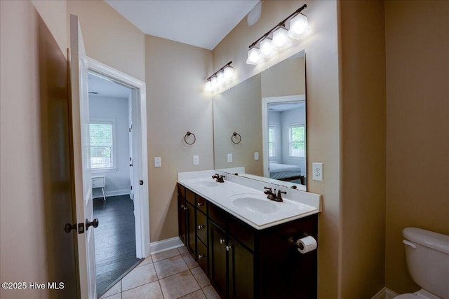 222 Station House Rd, New Bern, NC 28562 - full bath featuring ensuite bath, toilet, double vanity, baseboards, and tile patterned floors