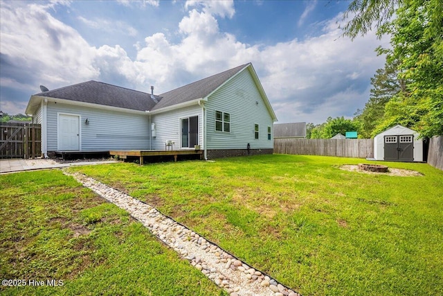 222 Station House Rd, New Bern, NC 28562 - back of house with a storage shed, an outdoor structure, and an outdoor fire pit