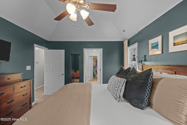 carpeted bedroom with lofted ceiling, ceiling fan, and baseboards