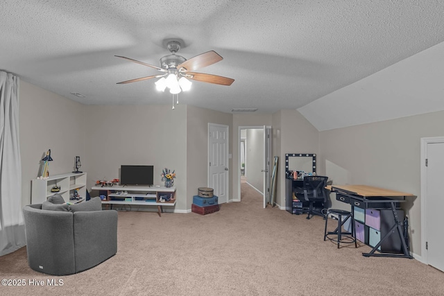 carpeted office with ceiling fan, a textured ceiling, baseboards, and lofted ceiling