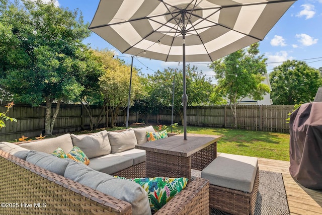 view of patio with an outdoor living space and a deck