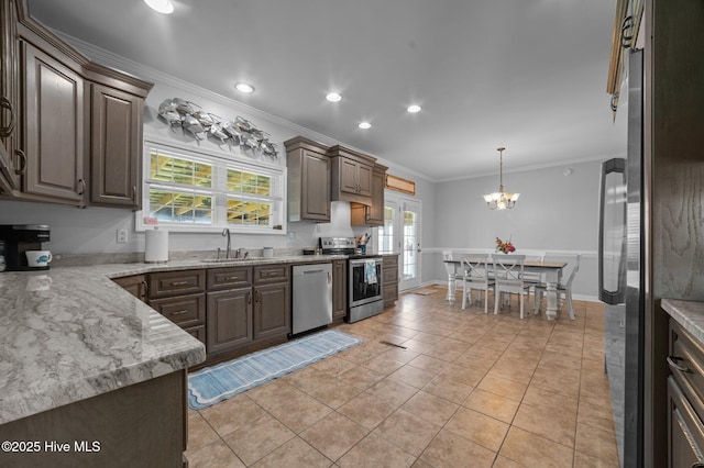 859 Old Pamlico Beach Rd W, Belhaven, NC 27810 - kitchen featuring appliances with stainless steel finishes, crown molding, a sink, a chandelier, and pendant lighting