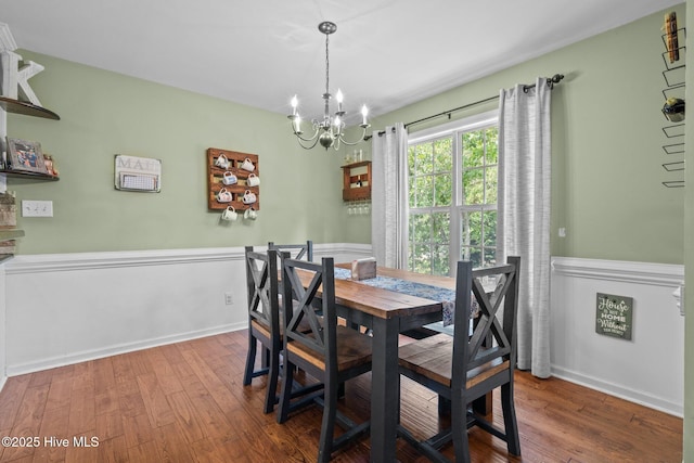 144 Newington Way, Aberdeen, NC 28315 - dining space featuring a chandelier, wood finished floors, and wainscoting
