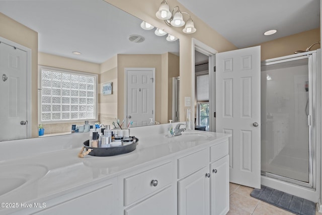 144 Newington Way, Aberdeen, NC 28315 - bathroom featuring a stall shower, double vanity, and tile patterned floors