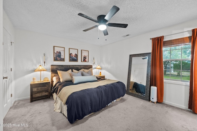 303 Foxtrace Ln, Hubert, NC 28539 - bedroom featuring carpet flooring, a textured ceiling, baseboards, and a ceiling fan