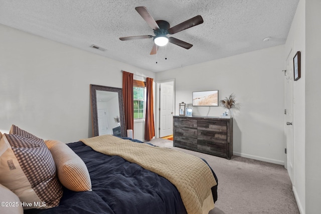303 Foxtrace Ln, Hubert, NC 28539 - bedroom featuring light colored carpet, baseboards, a textured ceiling, and ceiling fan