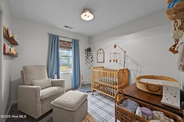303 Foxtrace Ln, Hubert, NC 28539 - bedroom with a nursery area, baseboards, and a textured ceiling
