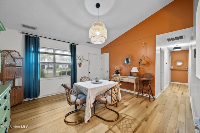 303 Foxtrace Ln, Hubert, NC 28539 - dining space with light wood-type flooring, vaulted ceiling, and baseboards