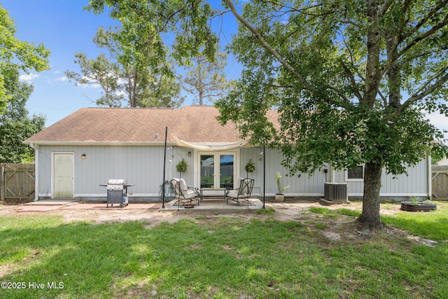 303 Foxtrace Ln, Hubert, NC 28539 - back of property with central air condition unit, a patio area, a shingled roof, and french doors