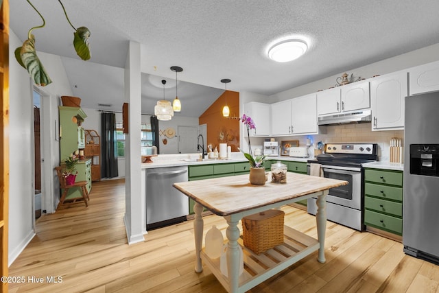 303 Foxtrace Ln, Hubert, NC 28539 - kitchen featuring appliances with stainless steel finishes, under cabinet range hood, green cabinetry, a sink, and a textured ceiling