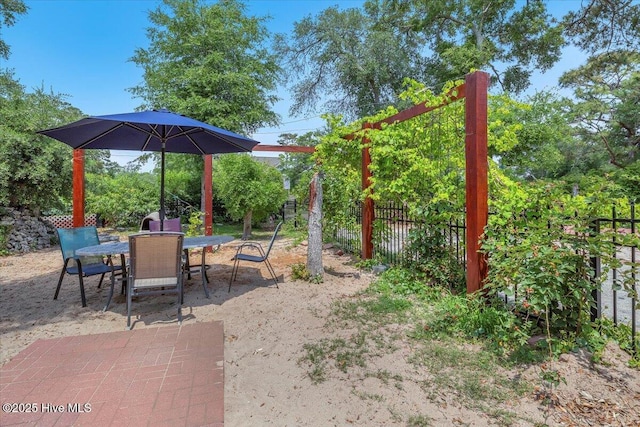 4407 E Oak Island Dr, Oak Island, NC 28465 - view of yard with outdoor dining area and a patio