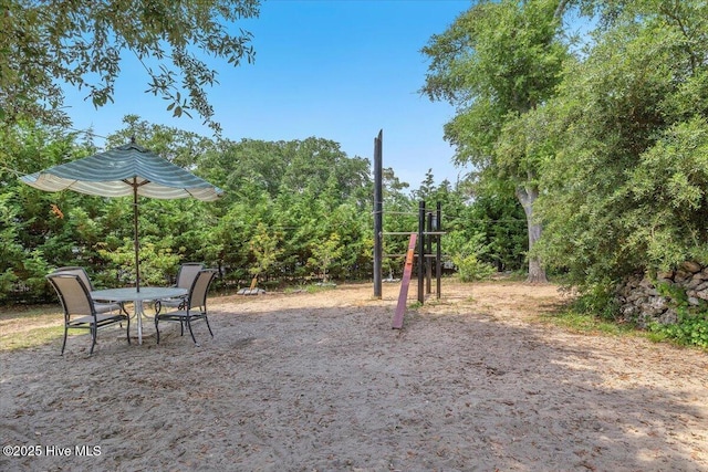 4407 E Oak Island Dr, Oak Island, NC 28465 - view of yard with outdoor dining area