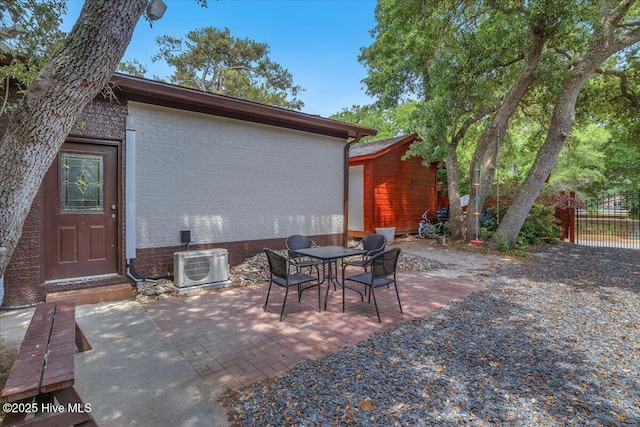 4407 E Oak Island Dr, Oak Island, NC 28465 - view of patio / terrace featuring ac unit and outdoor dining area