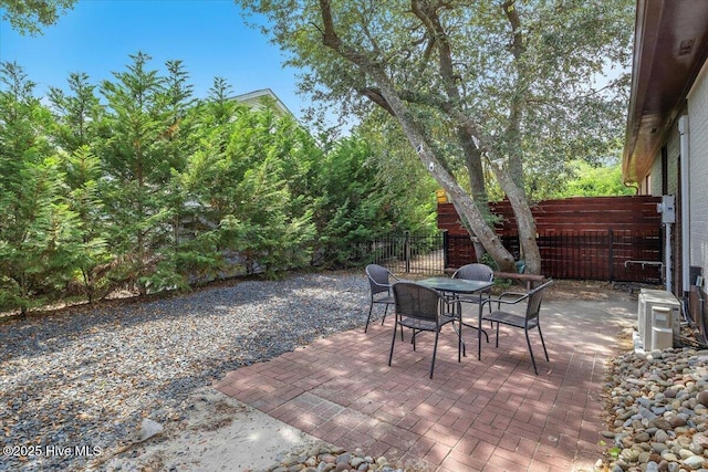 4407 E Oak Island Dr, Oak Island, NC 28465 - fenced backyard featuring outdoor dining area and a patio