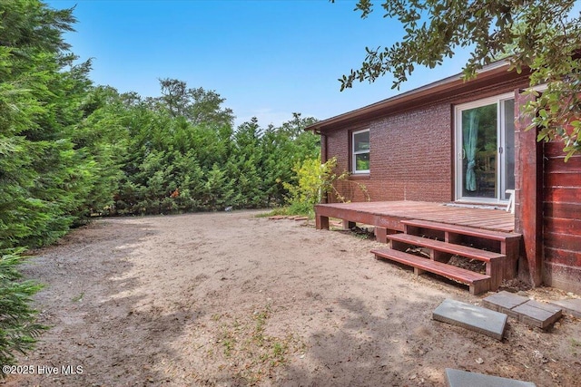 4407 E Oak Island Dr, Oak Island, NC 28465 - view of yard featuring a deck