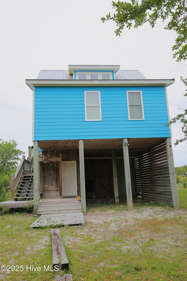 105 Sandy Landing Rd, Cedar Island, NC 28520 - back of property with stairs, metal roof, and a standing seam roof