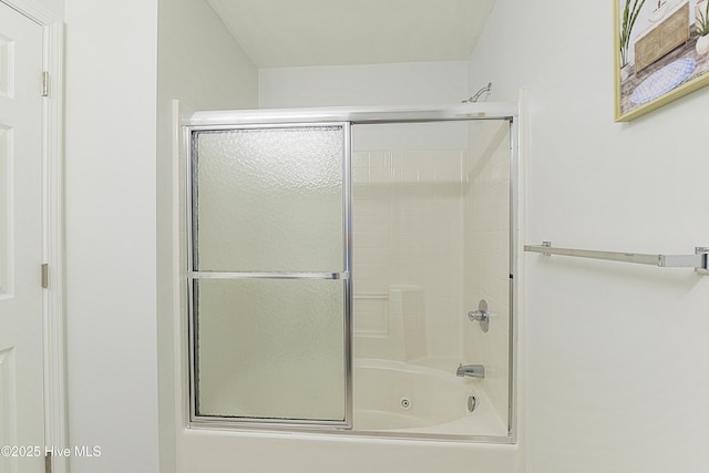 full bathroom featuring shower / bath combination with glass door