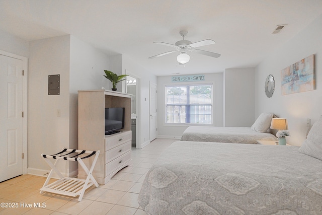 bedroom with light tile patterned flooring, baseboards, and a ceiling fan