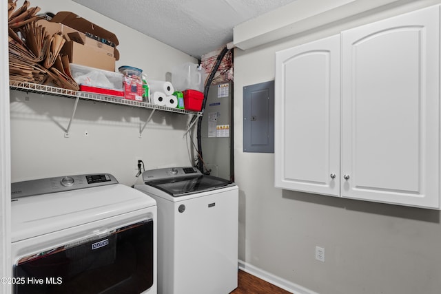 4115 Breezewood Dr Apt 202, Wilmington, NC 28412 - washroom with electric panel, cabinet space, washer and clothes dryer, a textured ceiling, and baseboards