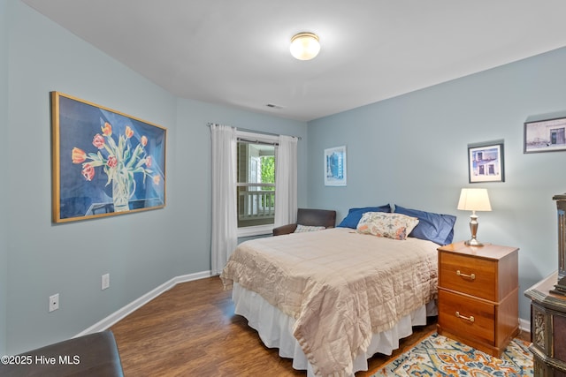 4115 Breezewood Dr Apt 202, Wilmington, NC 28412 - bedroom featuring wood finished floors and baseboards