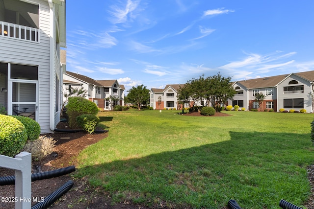 4115 Breezewood Dr Apt 202, Wilmington, NC 28412 - view of green lawn featuring a residential view