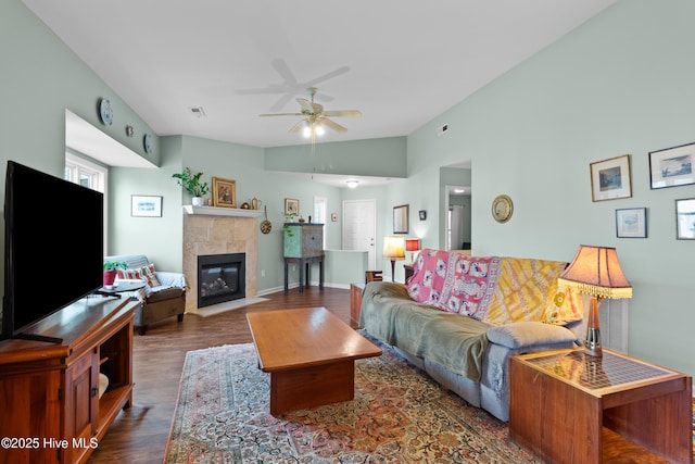 4115 Breezewood Dr Apt 202, Wilmington, NC 28412 - living area featuring a ceiling fan, a tile fireplace, wood finished floors, and vaulted ceiling
