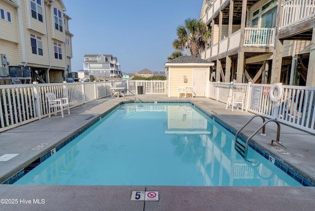 203 Summer Winds Pl, Surf City, NC 28445 - community pool featuring a residential view, fence, and a patio