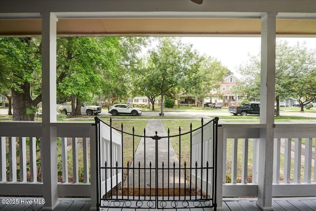 1721 Spencer Ave, New Bern, NC 28560 - gate with a residential view, a lawn, and covered porch