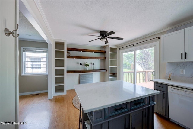 1721 Spencer Ave, New Bern, NC 28560 - kitchen with dishwasher, a textured ceiling, a ceiling fan, light wood finished floors, and a kitchen island