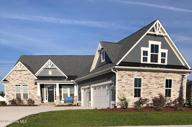 craftsman inspired home with a standing seam roof, stone siding, a front yard, a shingled roof, and concrete driveway