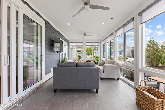 4224 Cobleskill Dr, Leland, NC 28451 - sunroom featuring ceiling fan, wood walls, recessed lighting, tile patterned flooring, and outdoor lounge area