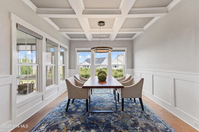 4224 Cobleskill Dr, Leland, NC 28451 - dining area with beamed ceiling, coffered ceiling, wood finished floors, a wainscoted wall, and a decorative wall
