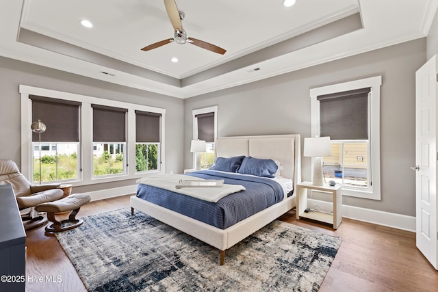 4224 Cobleskill Dr, Leland, NC 28451 - bedroom featuring a tray ceiling, ornamental molding, wood finished floors, recessed lighting, and ceiling fan
