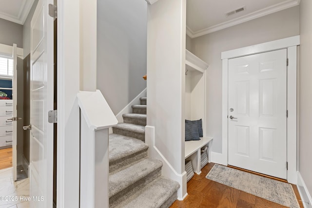 4224 Cobleskill Dr, Leland, NC 28451 - foyer entrance featuring crown molding, wood finished floors, stairs, and baseboards