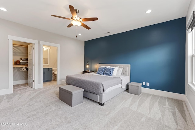 4224 Cobleskill Dr, Leland, NC 28451 - carpeted bedroom featuring baseboards, recessed lighting, a spacious closet, ceiling fan, and ensuite bath