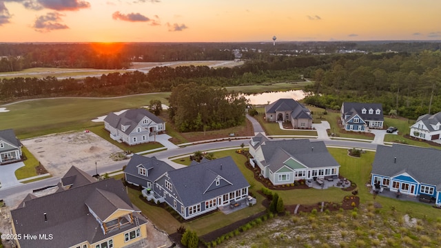 4224 Cobleskill Dr, Leland, NC 28451 - aerial view at dusk of a residential view, a water view, and view of golf course