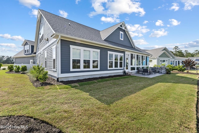 4224 Cobleskill Dr, Leland, NC 28451 - rear view of house featuring a patio, a yard, and roof with shingles