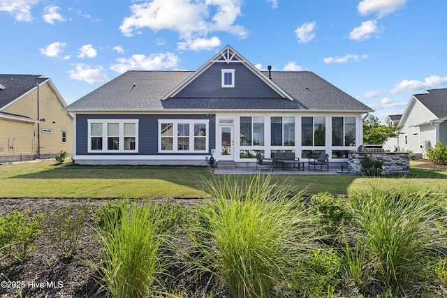 4224 Cobleskill Dr, Leland, NC 28451 - rear view of property featuring a patio, a lawn, and roof with shingles