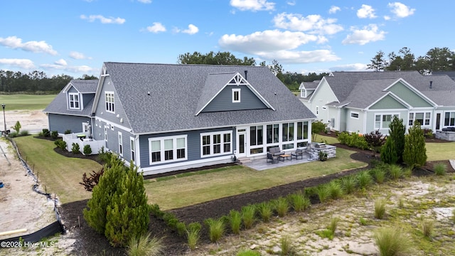 4224 Cobleskill Dr, Leland, NC 28451 - back of property featuring a patio, a shingled roof, and a yard