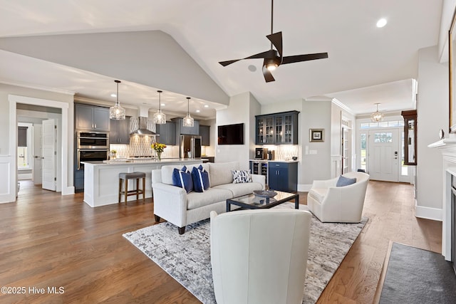 4224 Cobleskill Dr, Leland, NC 28451 - living area with a ceiling fan, lofted ceiling, dark wood-type flooring, crown molding, and recessed lighting