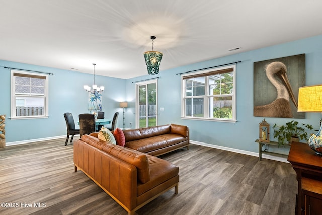 84 Capital Dr, Hampstead, NC 28443 - living area with wood finished floors, a chandelier, and baseboards