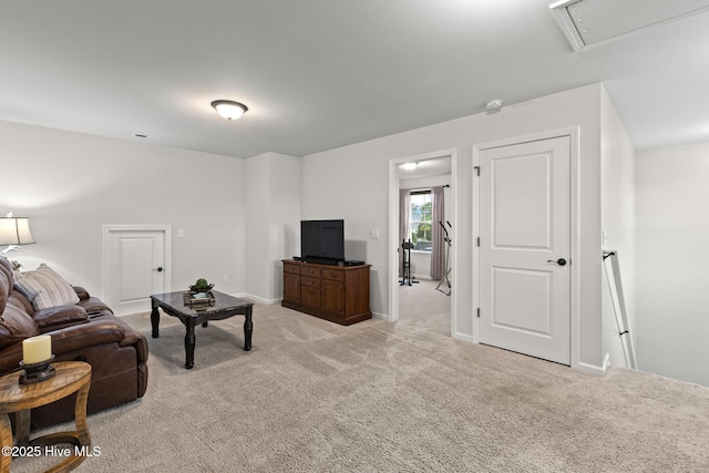 84 Capital Dr, Hampstead, NC 28443 - living room with attic access, light carpet, and baseboards