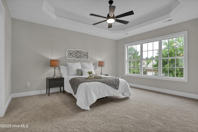 1306 Wakefield Ct, Winnabow, NC 28479 - carpeted bedroom featuring a raised ceiling, baseboards, crown molding, and a ceiling fan